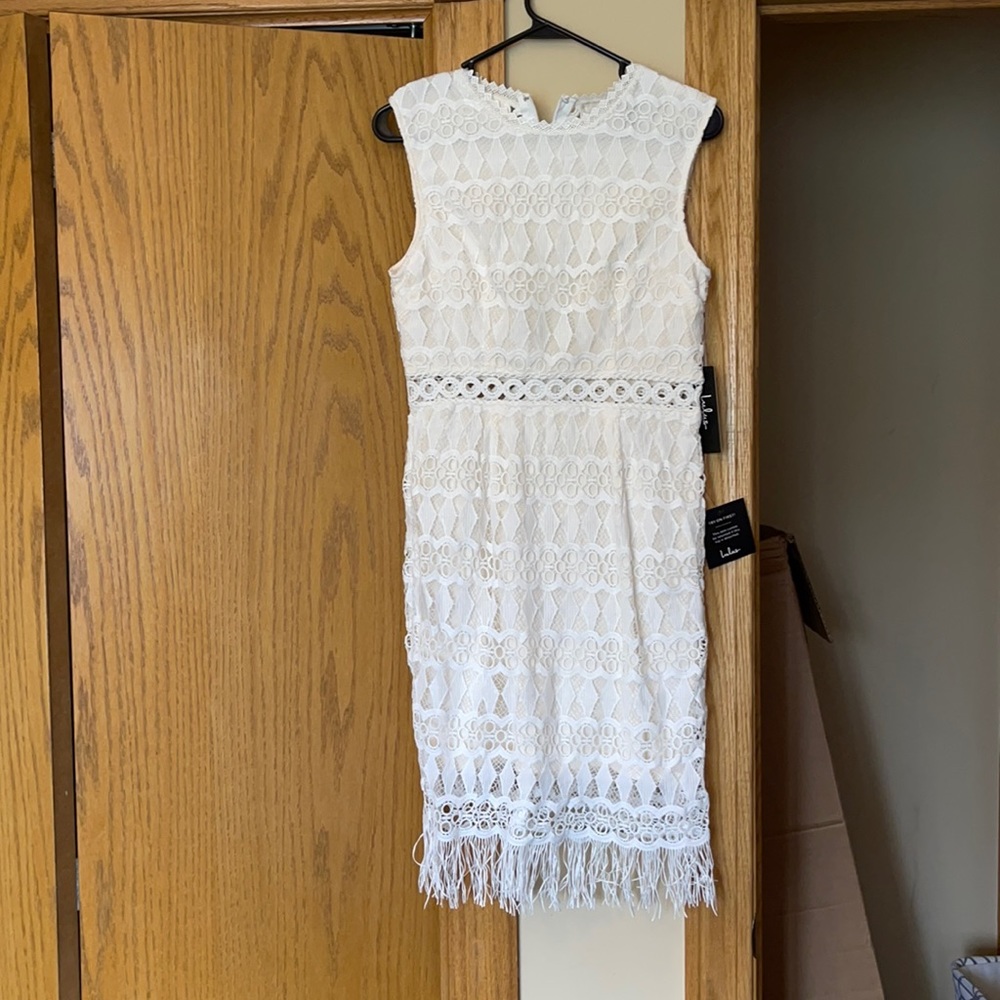 Brand new with tags, white dress. Size M